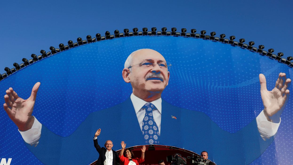 Kemal Kilicdaroglu, leader of Turkey's main opposition Republican People's Party, greets his supporters accompanied by his wife during a rally in Istanbul.