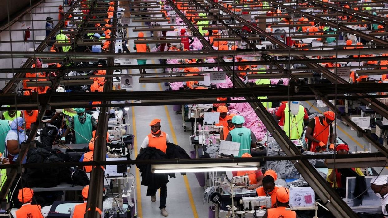 Kenyan workers prepare clothes for export in Kitengela, Kajiado County, Kenya, on September 19, 2025.