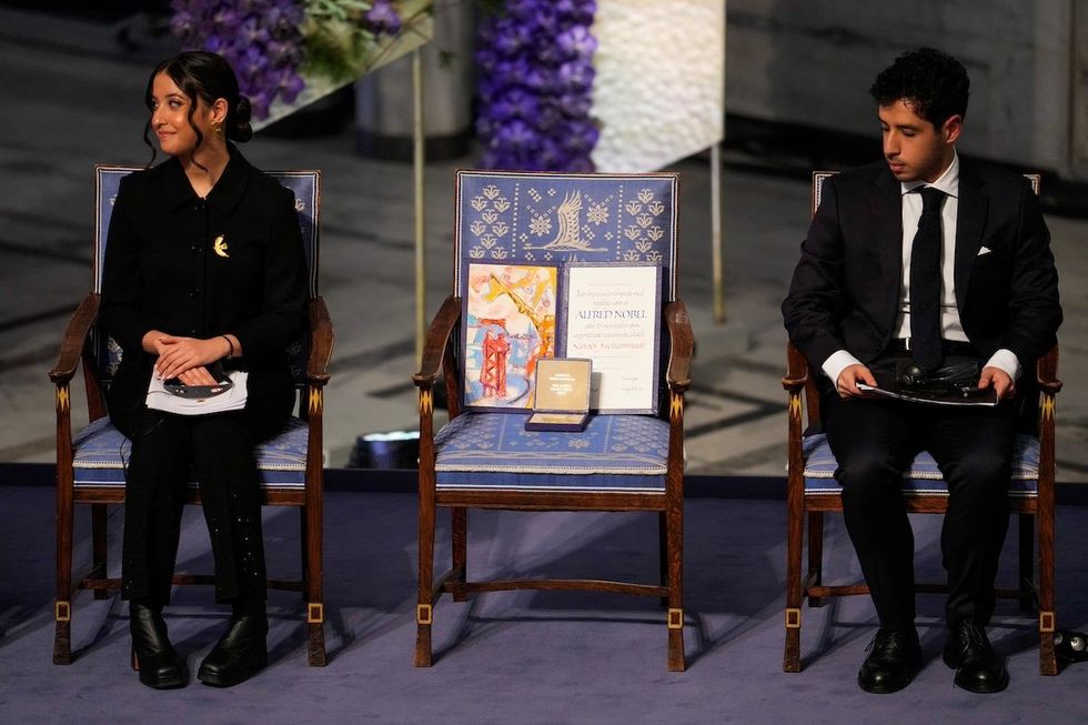 Kiana and Ali Rahmani, children of Narges Mohammadi, an imprisoned Iranian human rights activist, who was awarded the Nobel Peace Prize 2023, receive the award on behalf of their mother at Oslo City Hall, Norway December 10, 2023.