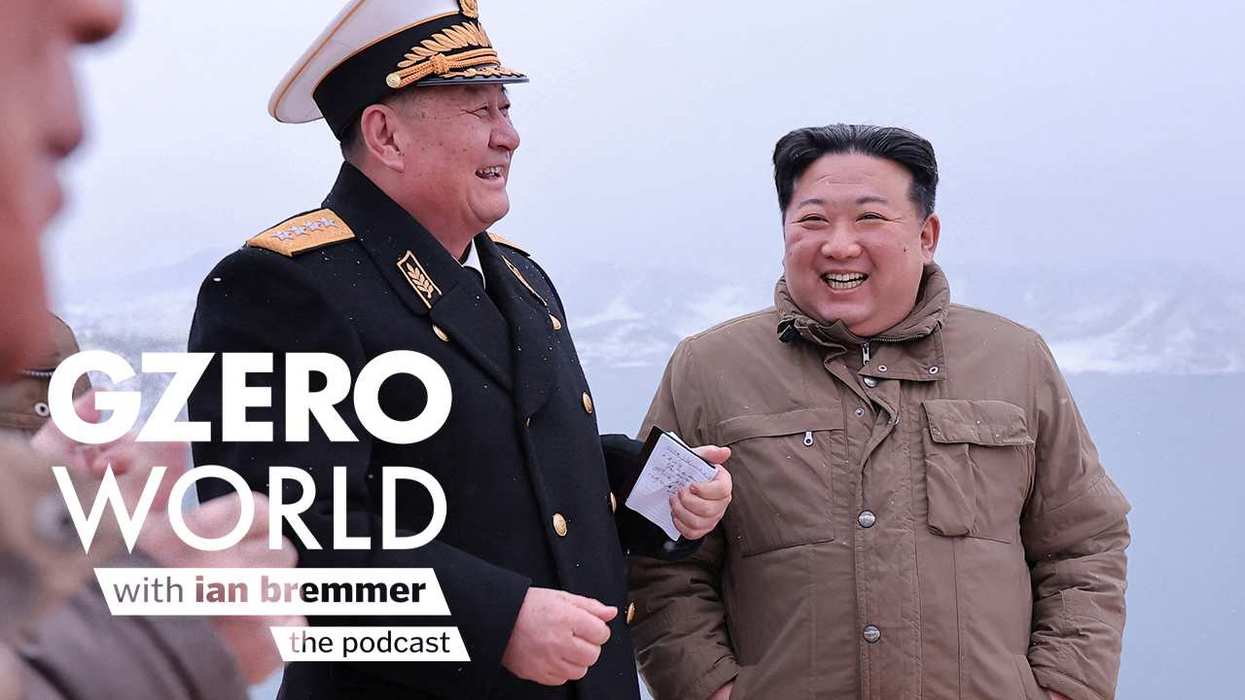 Kim Jong Un smiles alongside one of his generals