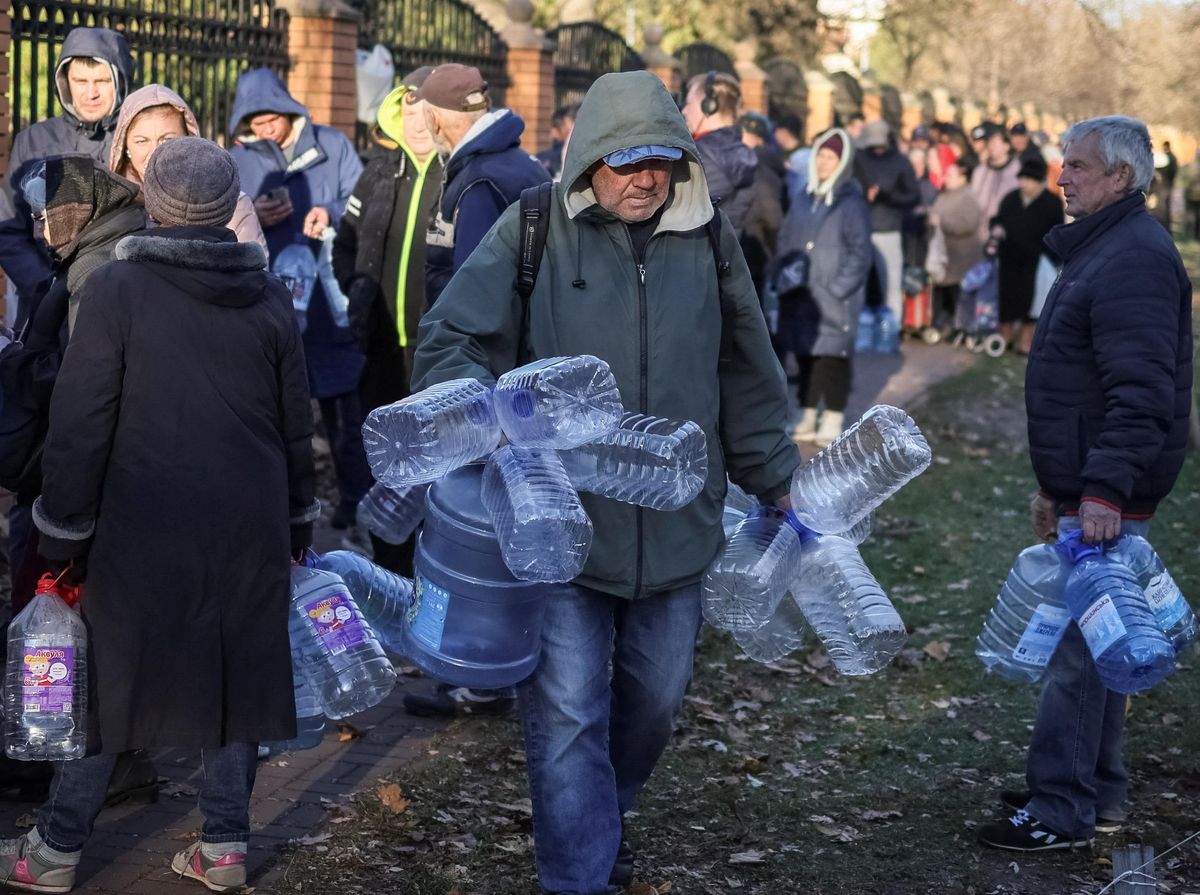 Kyiv residents line up for water after a Russian missile attack.
