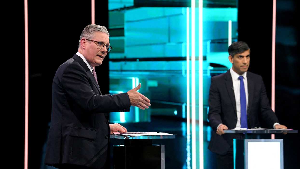 Labour Party leader Keir Starmer and Conservative Party leader and Prime Minister Rishi Sunak debate, as ITV hosts the first head-to-head debate of the General Election, in Manchester, Britain, June 4, 2024 in this handout image. J