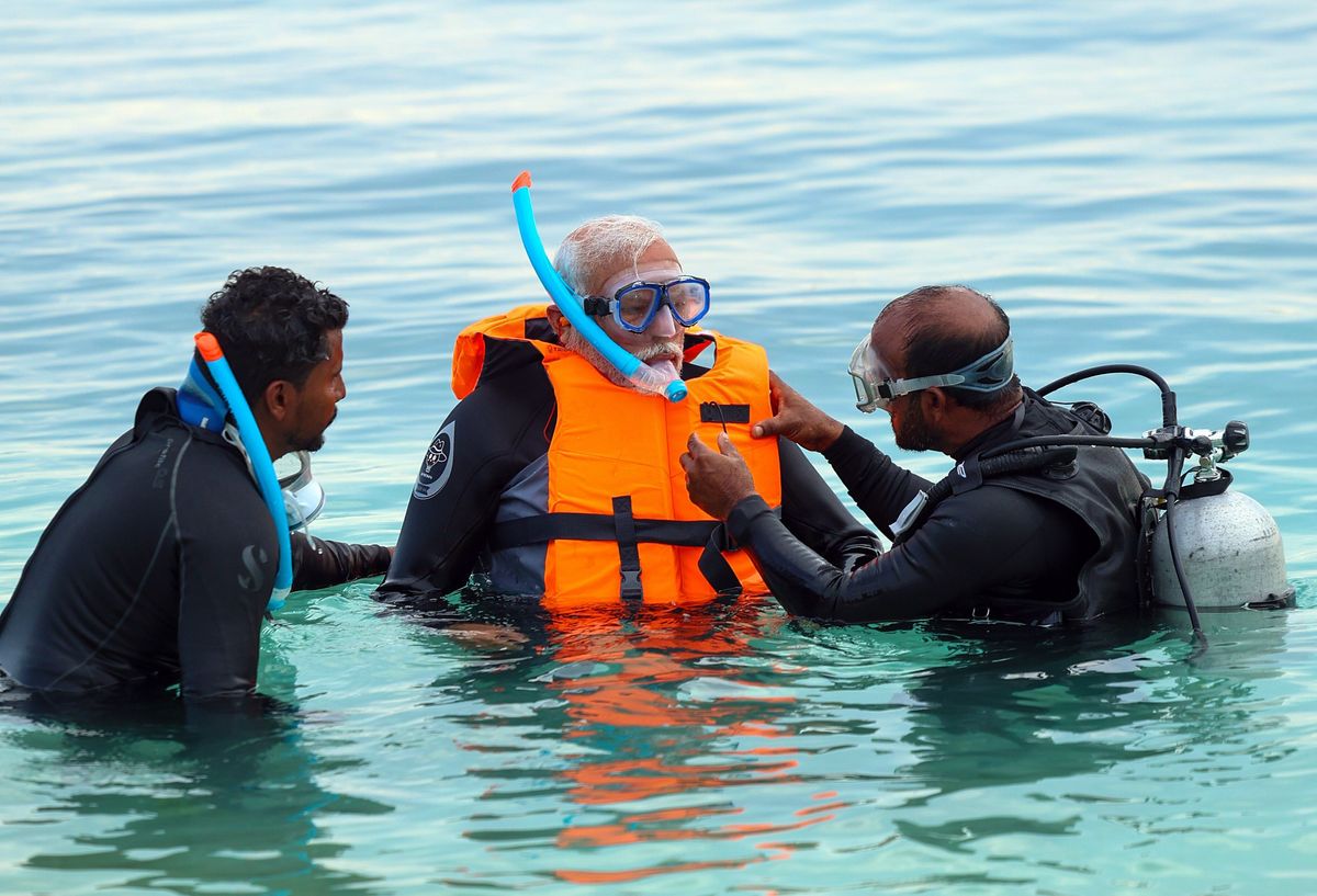 Lakshadweep, Jan 4 (ANI): Prime Minister Narendra Modi tries snorkelling on one of the pristine beaches, in Lakshadweep on Thursday. (ANI Photo)No Use India.