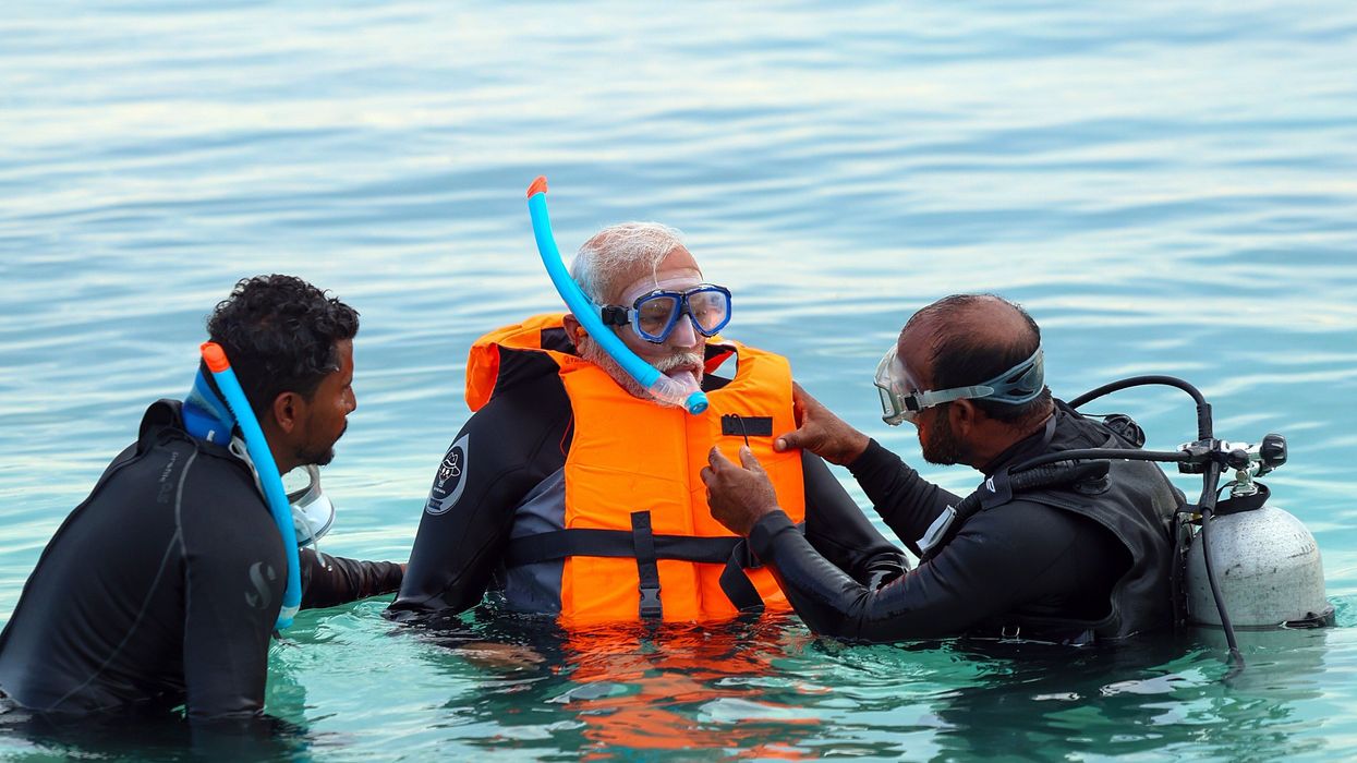 Lakshadweep, Jan 4 (ANI): Prime Minister Narendra Modi tries snorkelling on one of the pristine beaches, in Lakshadweep on Thursday. (ANI Photo)No Use India.