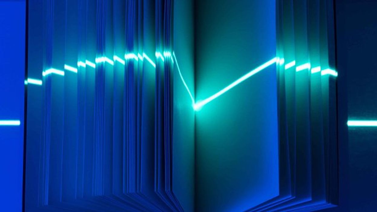 Laser pointing in the middle of an open book