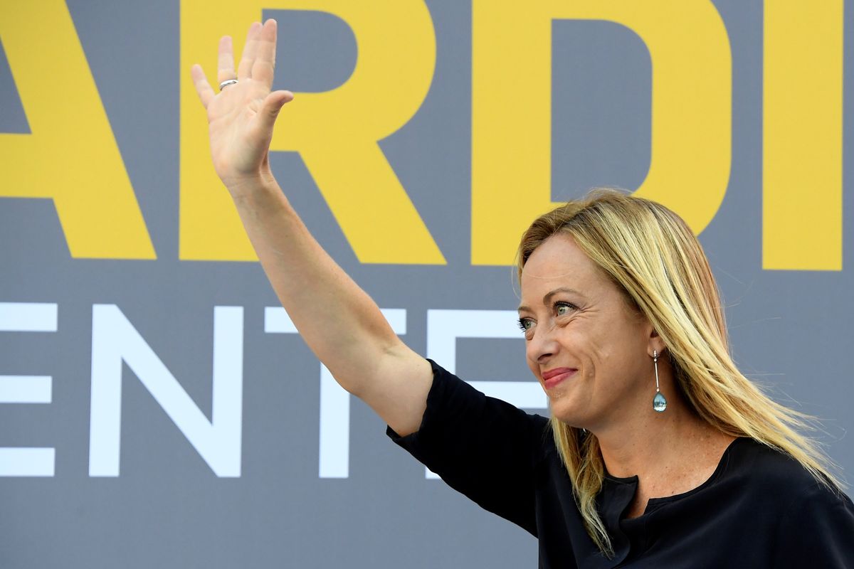 Leader of the far-right Brothers of Italy party Prime Minister Giorgia Meloni waves to the people 
