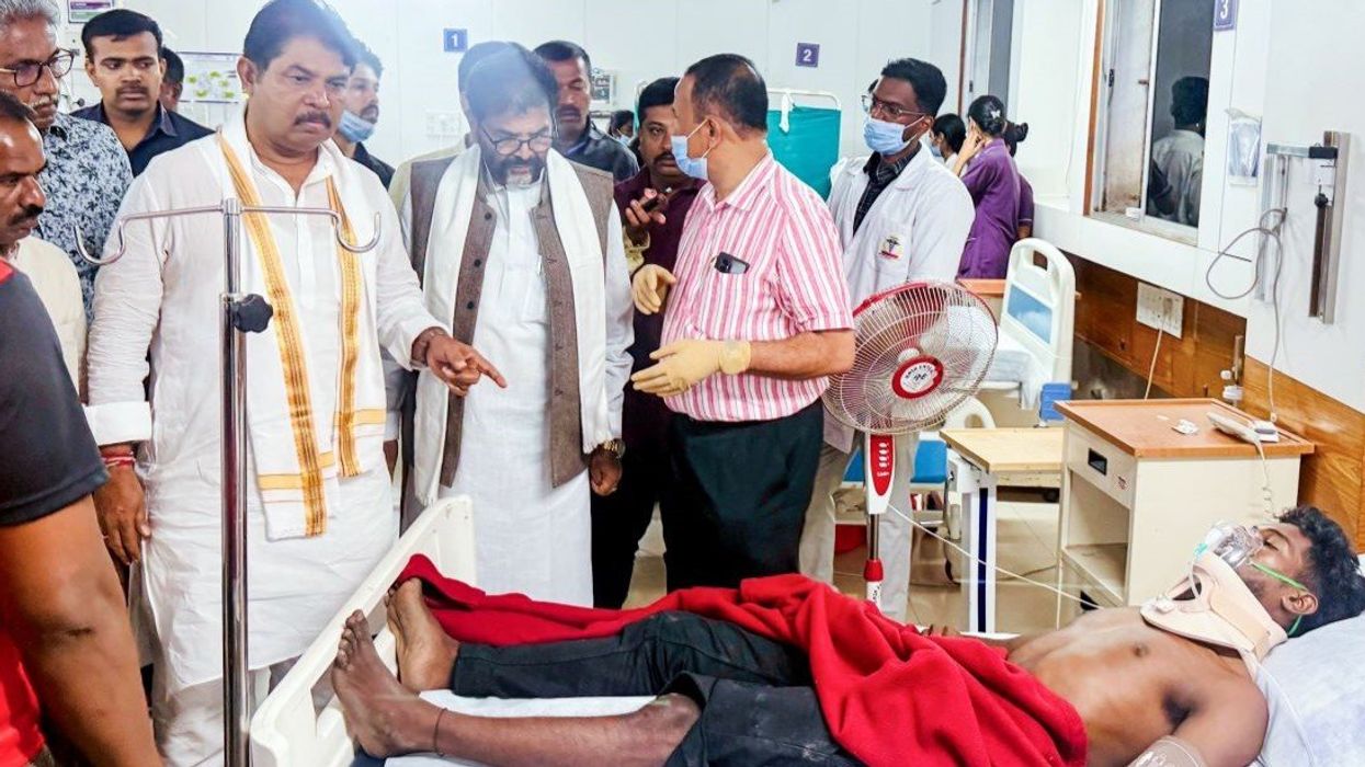 Leader of the Opposition of the Karnataka Assembly, R Ashok, with Bharatiya Janata Party (BJP) State President BY Vijayendra, meets the injured in the stampede at M Chinnaswamy Stadium, at a Hospital in Bengaluru on Wednesday.
