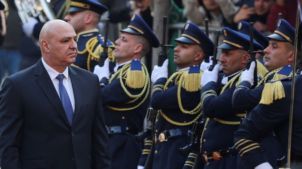 Lebanon's army chief Joseph Aoun walks past guards at the parliament building in Beirut, Lebanon, on Jan. 9, 2025.
