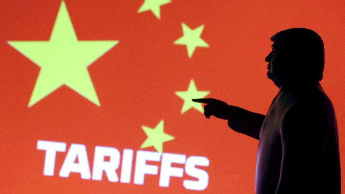 ​A 3D-printed miniature model depicting US President Donald Trump, the Chinese flag, and the word "tariffs" in this illustration taken on April 17, 2025.