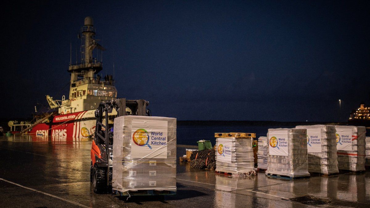 A crane moves humanitarian aid for Gaza in a joint mission between NGOs Open Arms and World Central Kitchen at the port of Larnaca, Cyprus, March 8, 2024. 