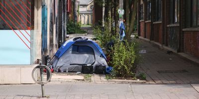 A homeless man's tent is seen in an alley in downtown Toronto, Ontario.