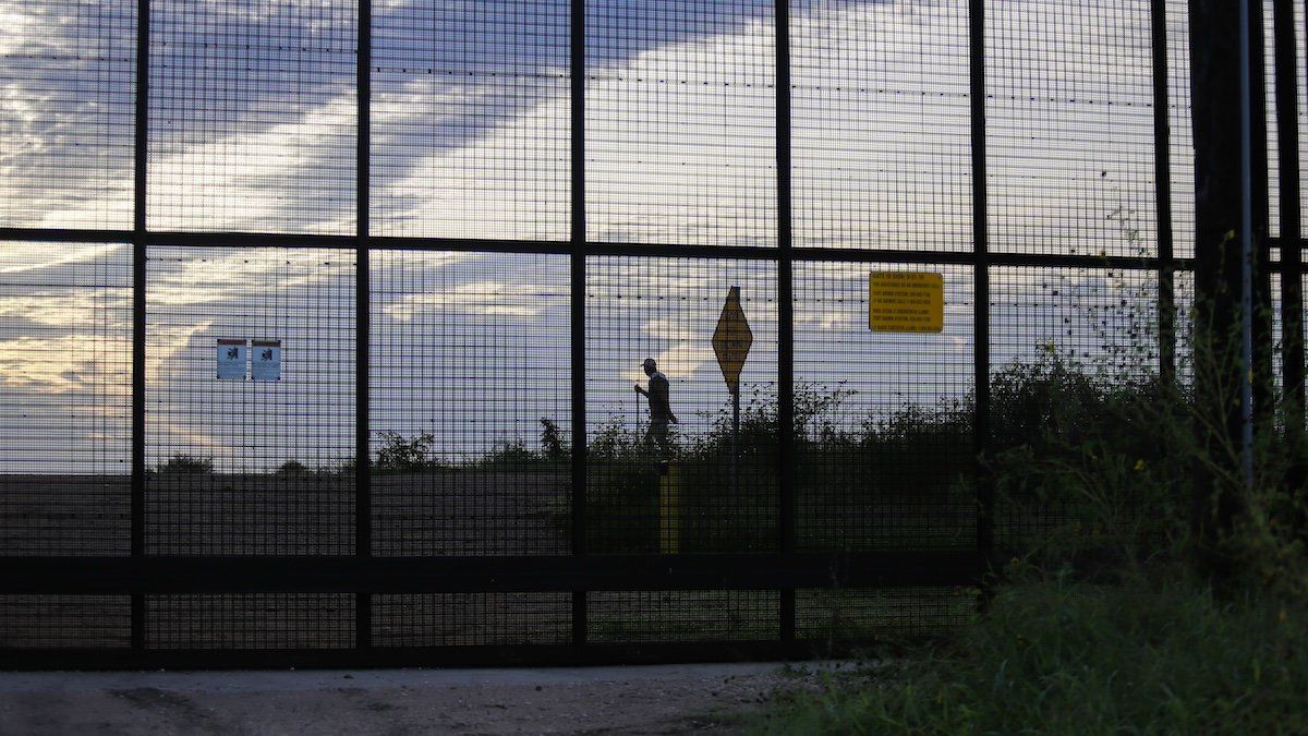 A man walks his dog on the Mexican side of a section of the U.S.-Mexican Border wall on Wednesday morning, September 7th, 2022, as seen from Cameron County, Texas