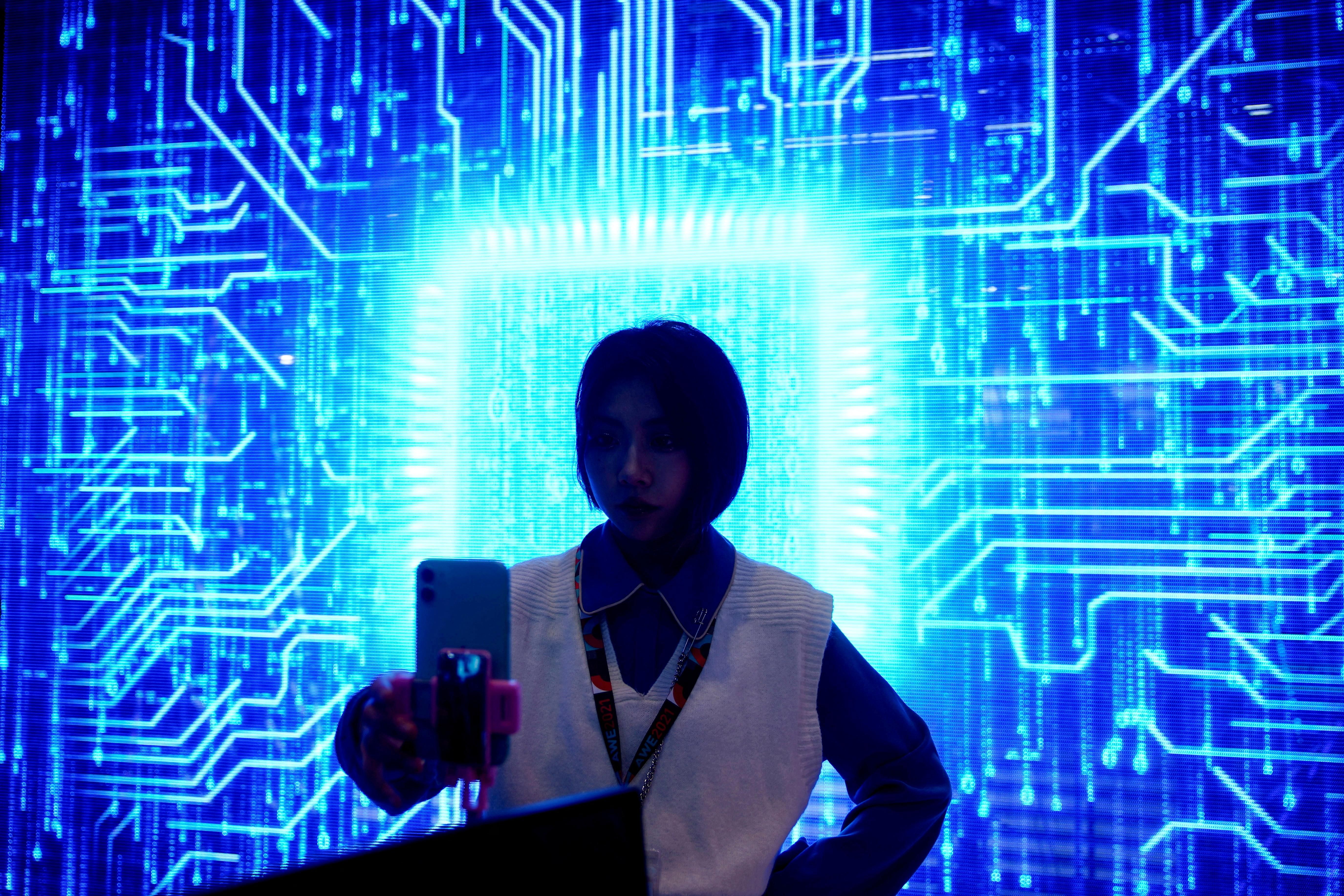 A woman visits a semiconductor device display in Shanghai, China.