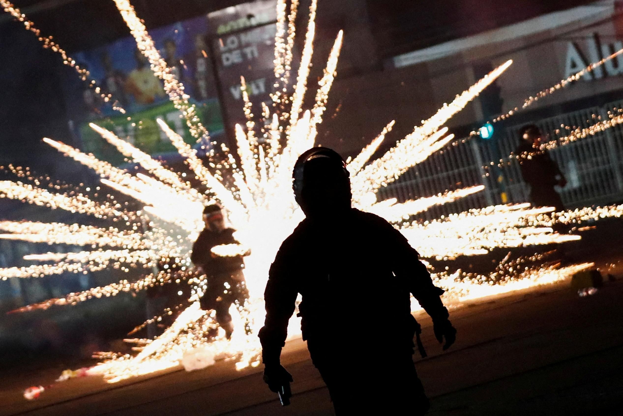 Bolivian riot police officers clash with demonstrators as protests following the arrest of Santa Cruz governor and right-wing opposition leader Luis Fernando Camacho.