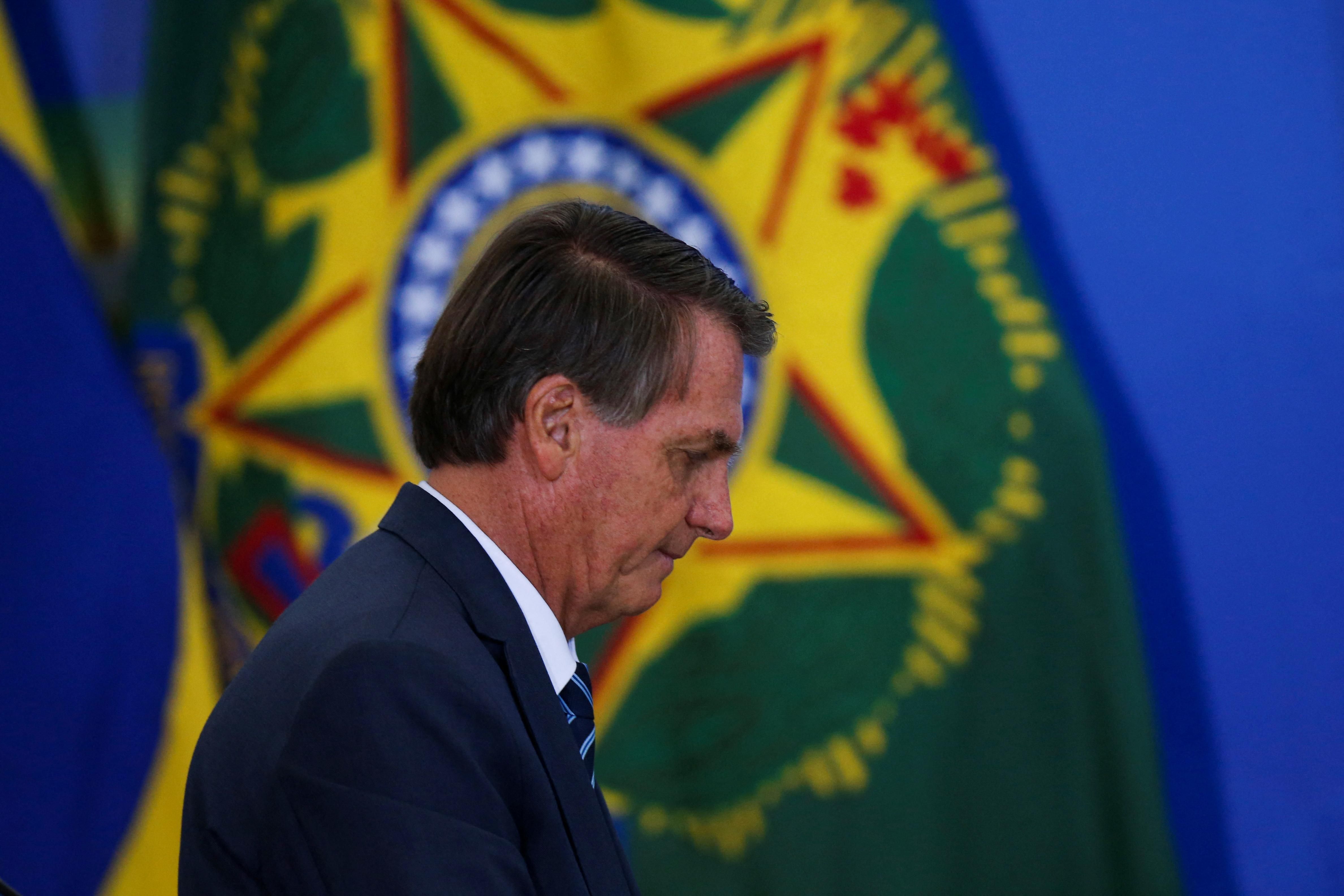 Brazil's President Jair Bolsonaro walks during a ceremony at the Planalto Palace in Brasilia, Brazil February 2, 2022.