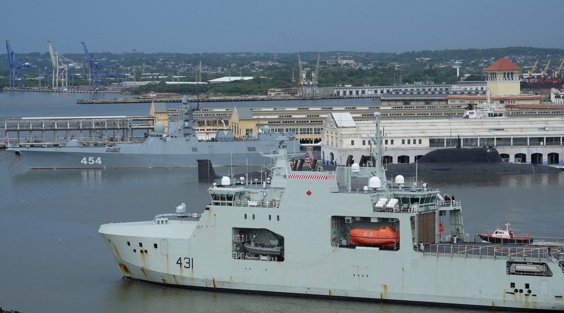 Canadian navy patrol boat HMCS Margaret Brooke passes by Russian nuclear-powered cruise missile submarine Kazan and frigate Admiral Gorshkov, as it enters Havana’s bay, Cuba, June 14, 2024. 
