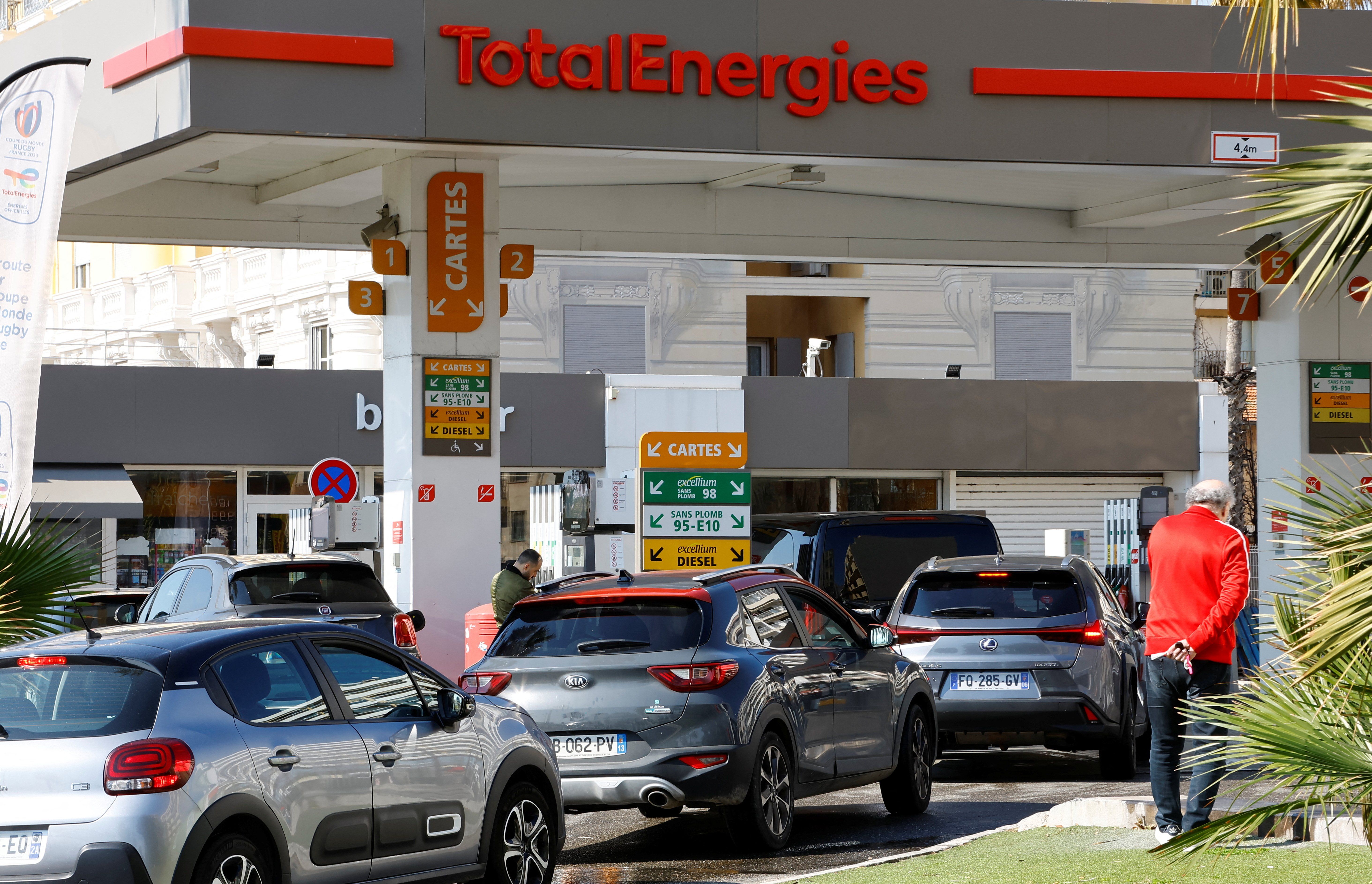 Car drivers queue to fill their fuel tank at a TotalEnergies gas station in Nice as petrol supplies are disrupted by a strike of French refineries and depots, France, March 20, 2023.