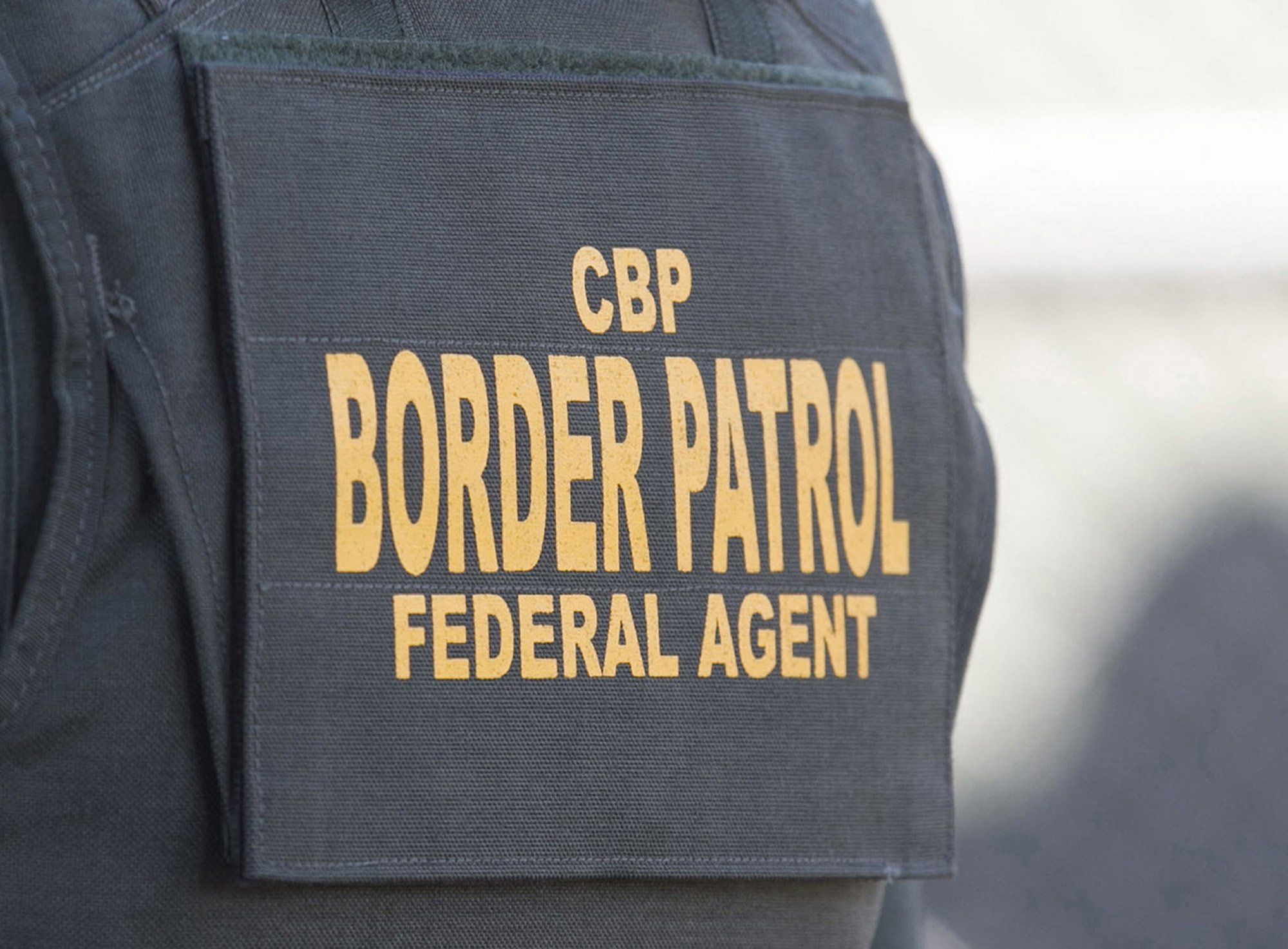 CBP Border Patrol agent during a news conference announcing the completion of border wall prototypes in San Diego.