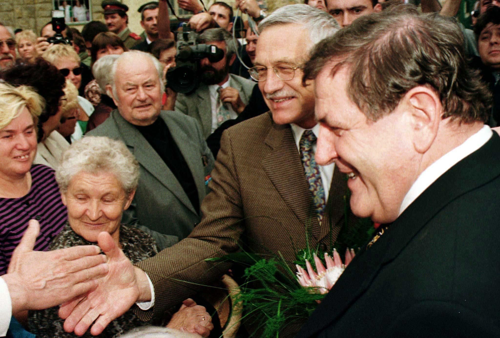 Czech Prime Minister Vaclav Klaus and his Slovak counterpart Vladimir Meciar greeted by a crowd in 1993.