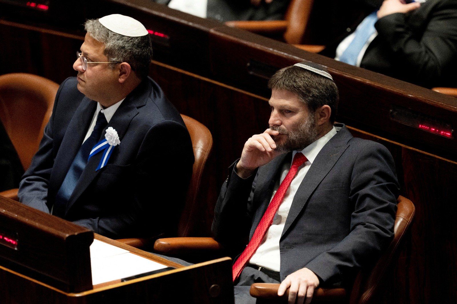 Far-right Israeli lawmakers Itamar Ben Gvir, center, and Bezalel Smotrich, right, attend the swearing-in ceremony for the Knesset