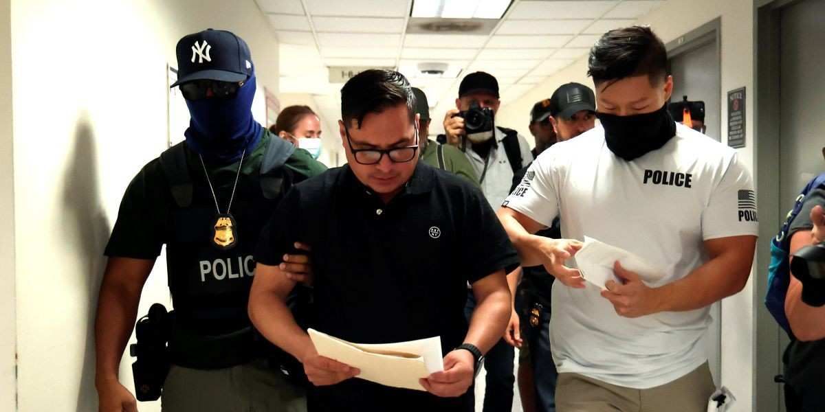 Federal officers detain a man at the Immigration court office areas at the Jakob Javits Federal Builing in Lower Manhattan on July 28,2025 in New York City.