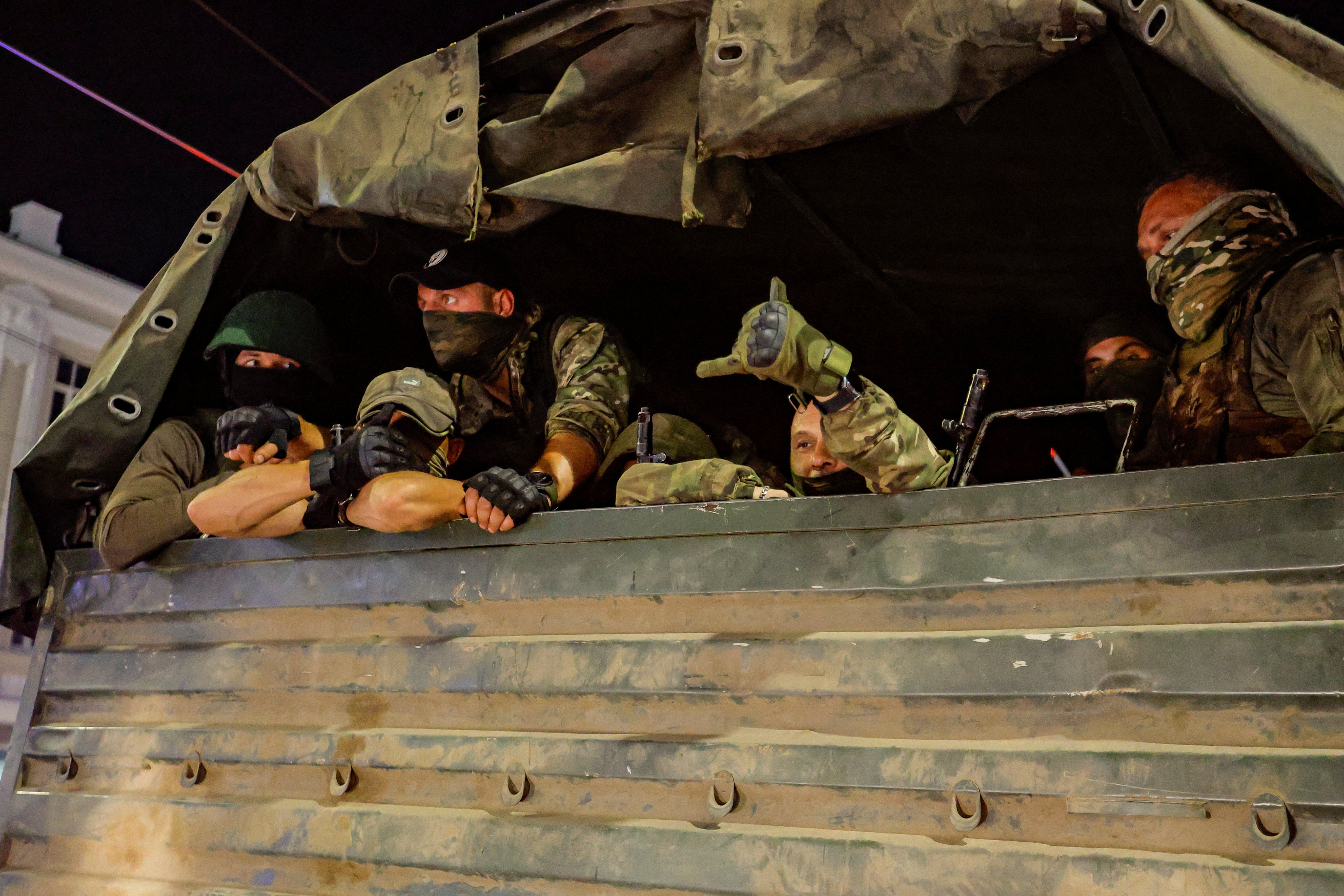 Fighters of Wagner private mercenary group pull out of the headquarters of the Southern Military District in the city of Rostov-on-Don, Russia.