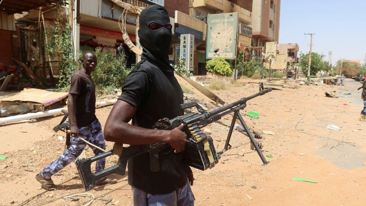 ​FILE PHOTO: A member of Sudanese armed forces looks on as he holds his weapon in the street in Omdurman, Sudan, March 9, 2024. 