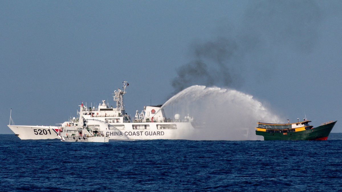 ​FILE PHOTO: Chinese Coast Guard vessels fire water cannons towards a Philippine resupply vessel Unaizah May 4 on its way to a resupply mission at Second Thomas Shoal in the South China Sea, March 5, 2024. 