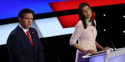 Florida Gov. Ron DeSantis and fomrer US Ambassador to the United Nations Nikki Haley listen to a question as they participate in the Republican presidential debate hosted by CNN at Drake University in Des Moines, Iowa.