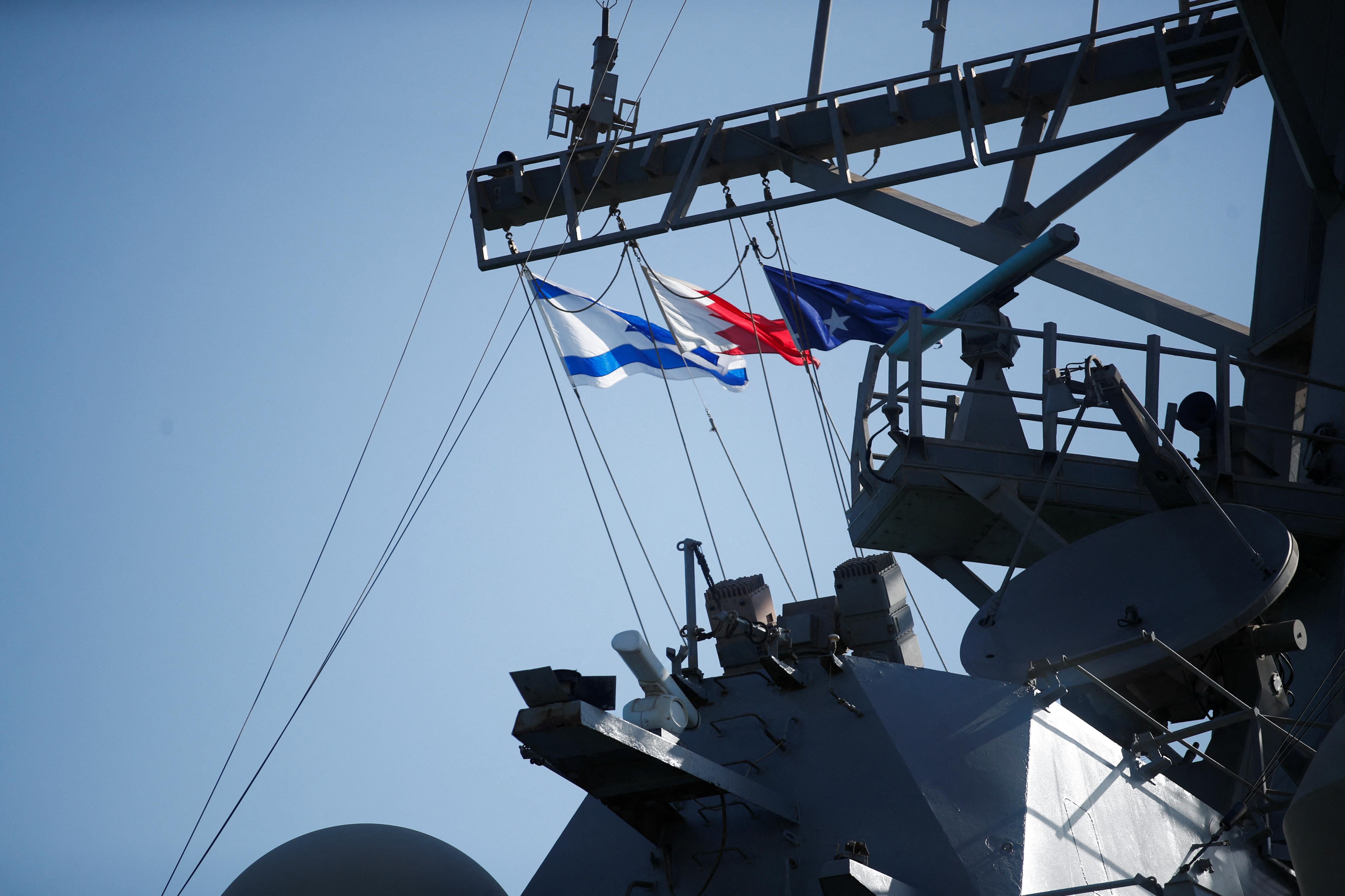 Israeli and Bahraini flags are seen on USS COLE (DDG-67) during Defence Minister Benny Gantz's visit to 5th Fleet Headquarters Navy Base in Juffair, Bahrain, February 3, 2022.