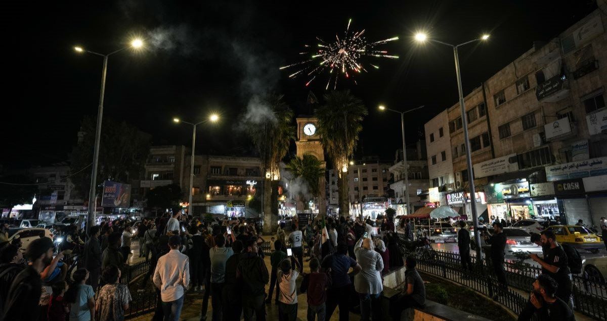 ​Syrians set off fireworks during celebrations in Clock Square in the center of Idlib city, after US President Donald Trump's decision to lift sanctions on Syria.