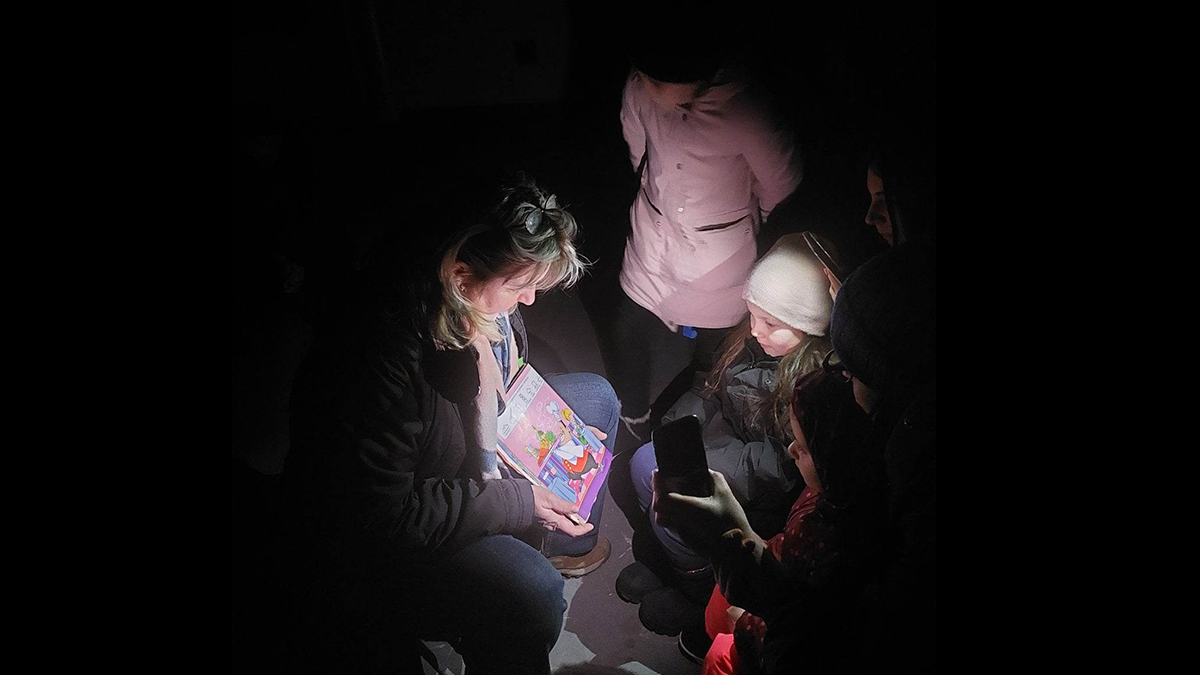 Marina Kudriavtseva teaches her pupils in the dark in Kyiv, Ukraine.