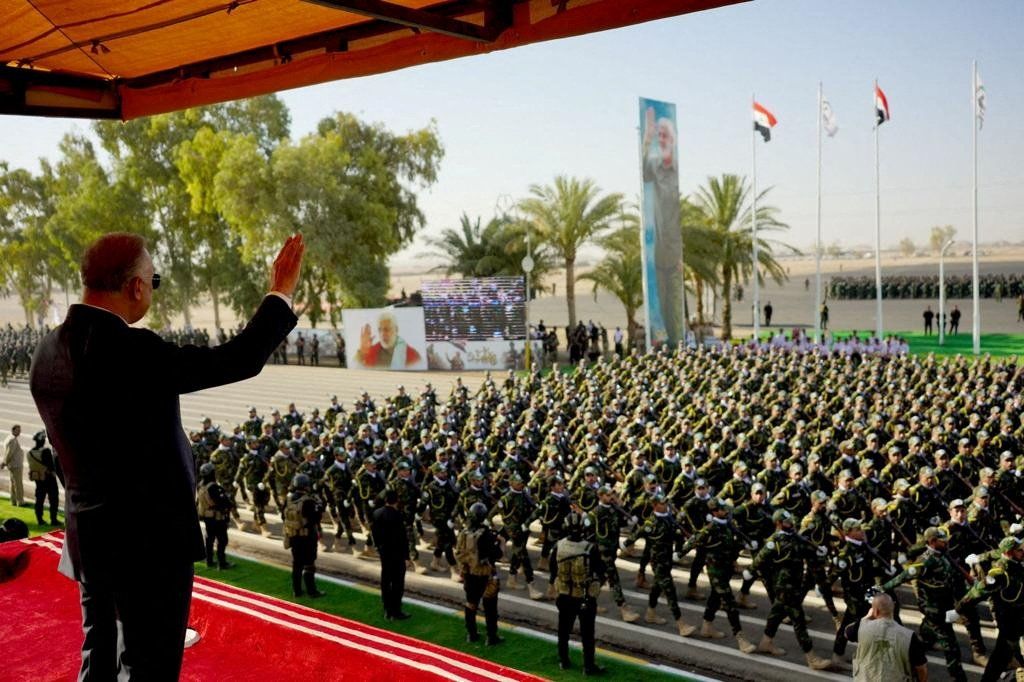 Members of Iraqi Popular Mobilization Forces (PMF) marking its eighth anniversary, in Diyala province, Iraq. 