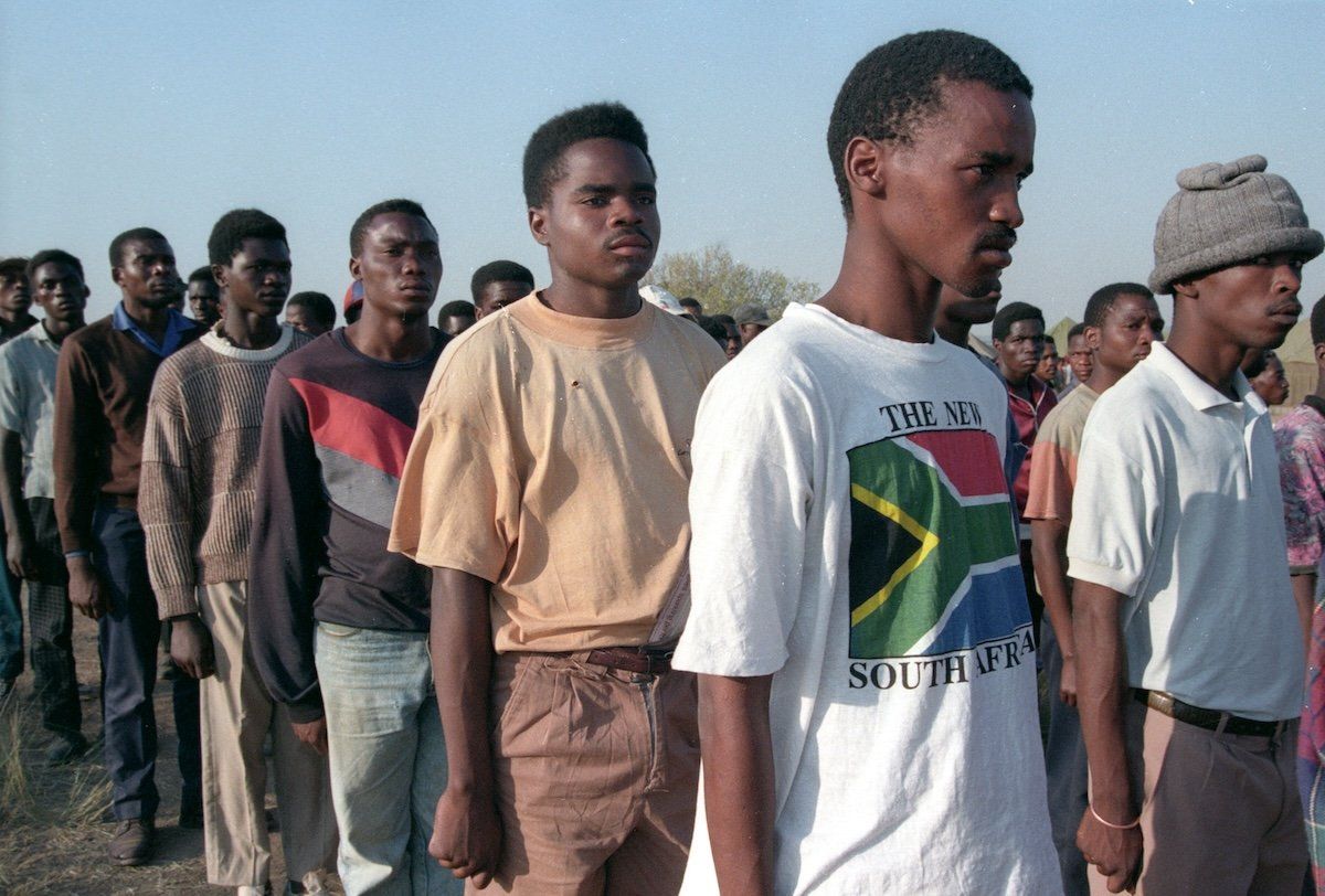 ​Members of the armed wing of Nelson Mandela's African National Congress line up waiting to vote in a military base north of Pretoria, on April 26, 1994. 