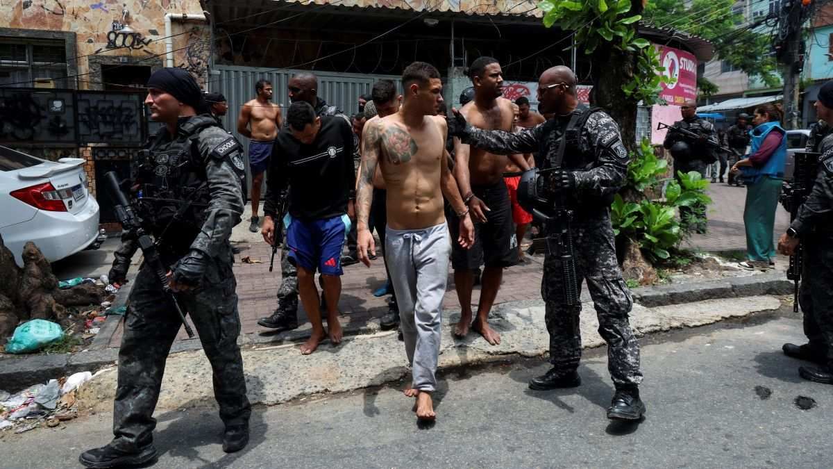 ​Members of the military police special unit detain suspected drug dealers at the favela do Penha, in Rio de Janeiro, Brazil, on October 28, 2025.