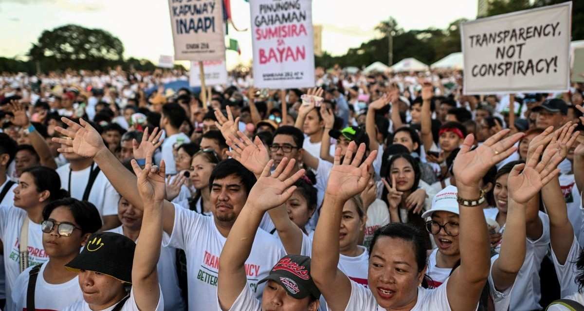 Members of the religious group Iglesia ni Cristo (Church of Christ) wave their hands during the first of a three-day anti-corruption protest at the Quirino Grandstand, Manila, Philippines, November 16, 2025.