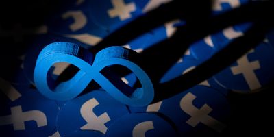 Meta and Facebook logos shown in an illustration.