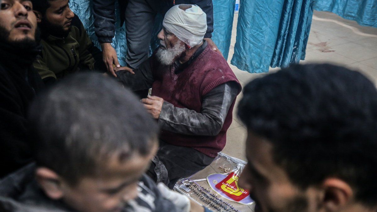 Palestinians are carrying injured victims to the hospital following an Israeli airstrike on a residential building in Deir al-Balah, central Gaza Strip, on March 7, 2024, as battles continue between Israel and the Palestinian Hamas movement.