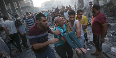 Palestinians evacuate an injured girl following an Israeli airstrike in central Gaza, on Oct. 18, 2023, amid the ongoing battles between Israel and Hamas.