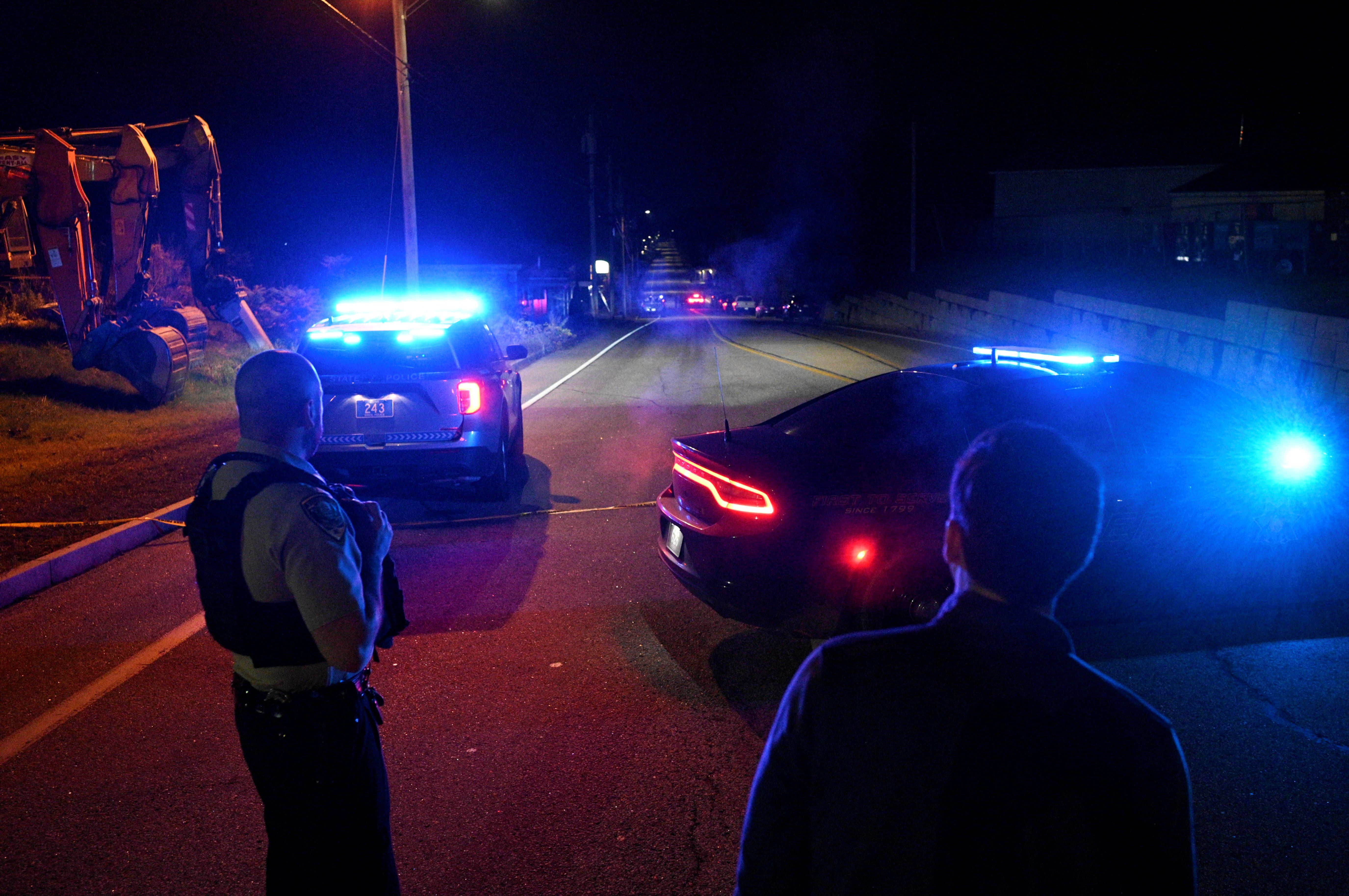 Police close Lincoln Street leading to Schemengees Bar & Grille Restaurant after deadly mass shootings in Lewiston, Maine, U.S. October 26, 2023.