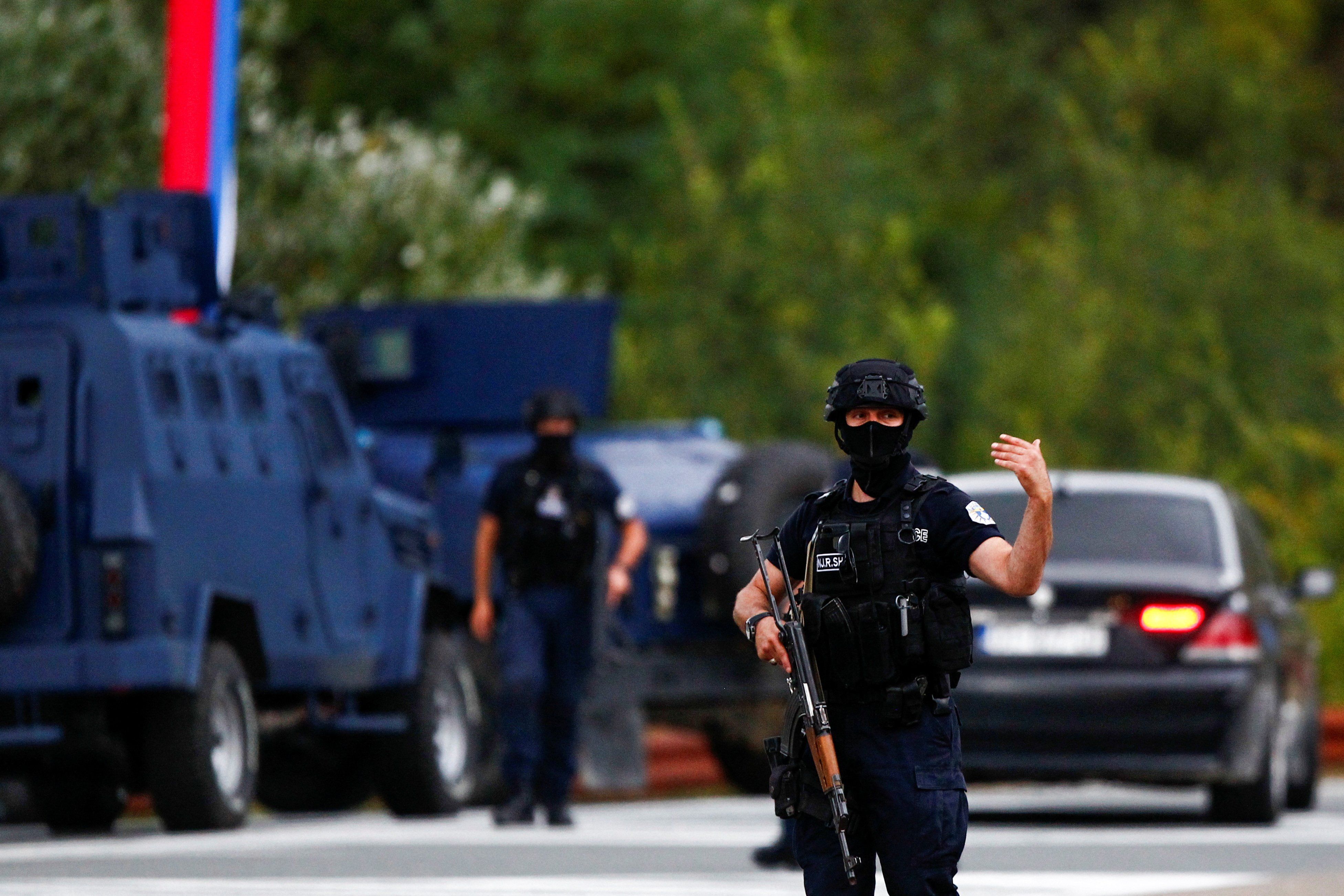 Police officers patrol in the aftermath of a shooting, at the road to Banjska village, Kosovo September 24, 2023.