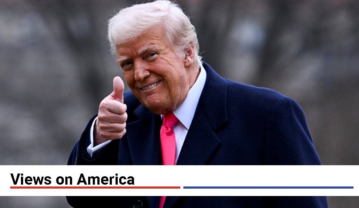 ​President Donald Trump giving a thumbs up.