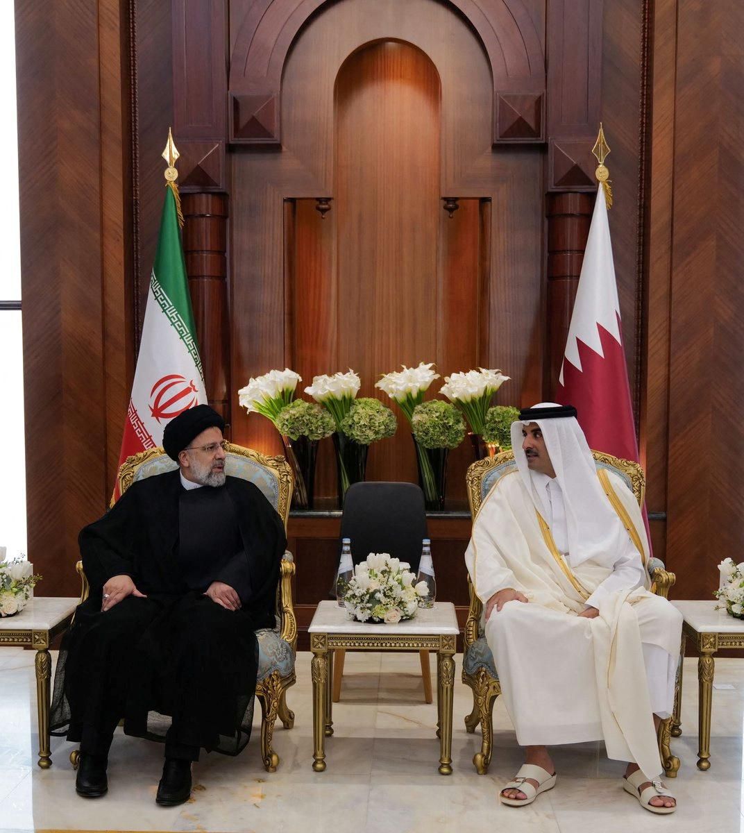 Qatar's Emir Sheikh Tamim bin Hamad Al-Thani meets with Iran's President Ebrahim Raisi, in Doha. 