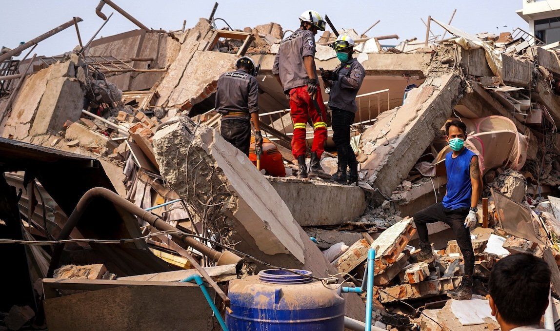 ​Rescuers work at the site of a building that collapsed after the strong earthquake in Mandalay, Myanmar, on Sunday, March 30, 2025. 