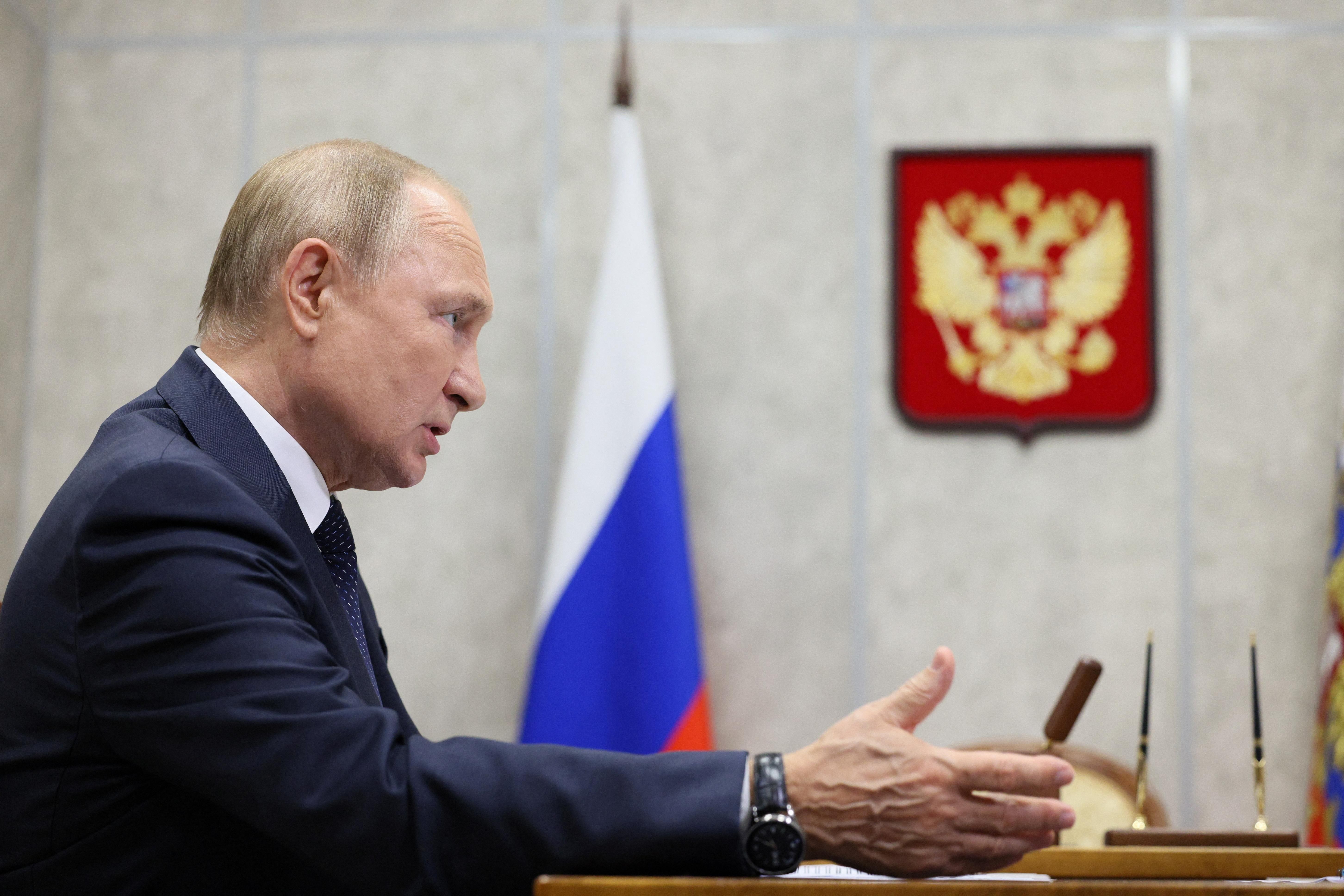 Russian President Vladimir Putin attends a meeting in Veliky Novgorod. 