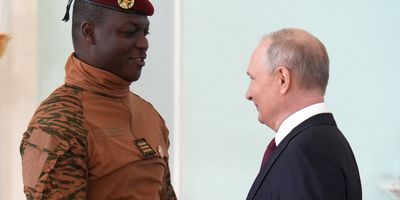 Russia's President Vladimir Putin shakes hands with Burkina Faso's interim President Ibrahim Traore at the Russia-Africa Summit in Russia in July.
