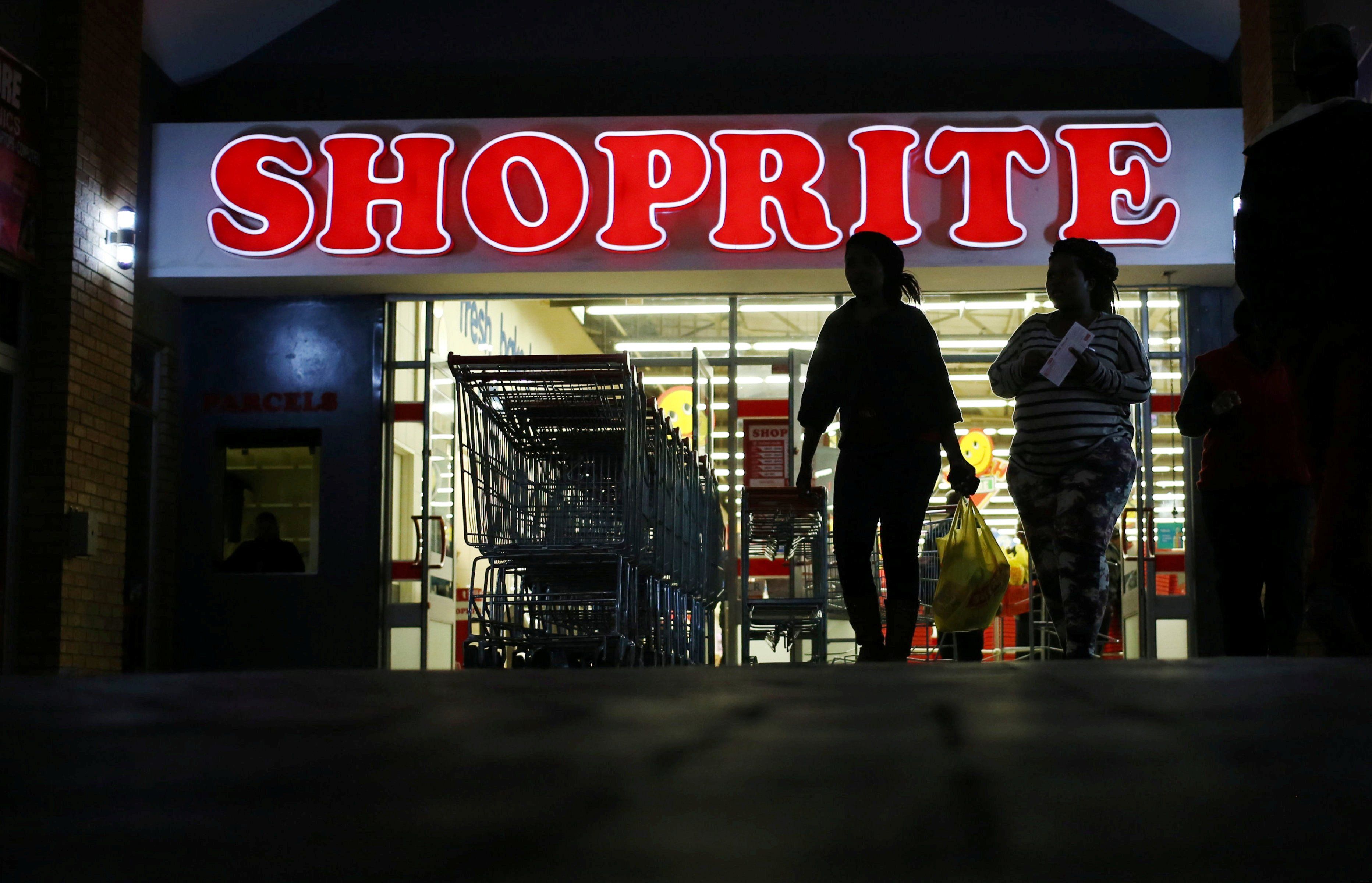 ​Shoppers leave the Shoprite store in Daveyton, South Africa May 23, 2018. 