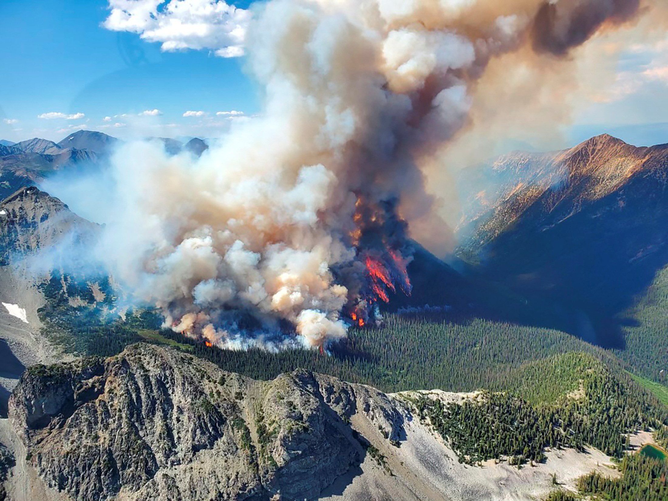 Smoke rises from the Texas Creek wildfire south of Lillooet, British Columbia.