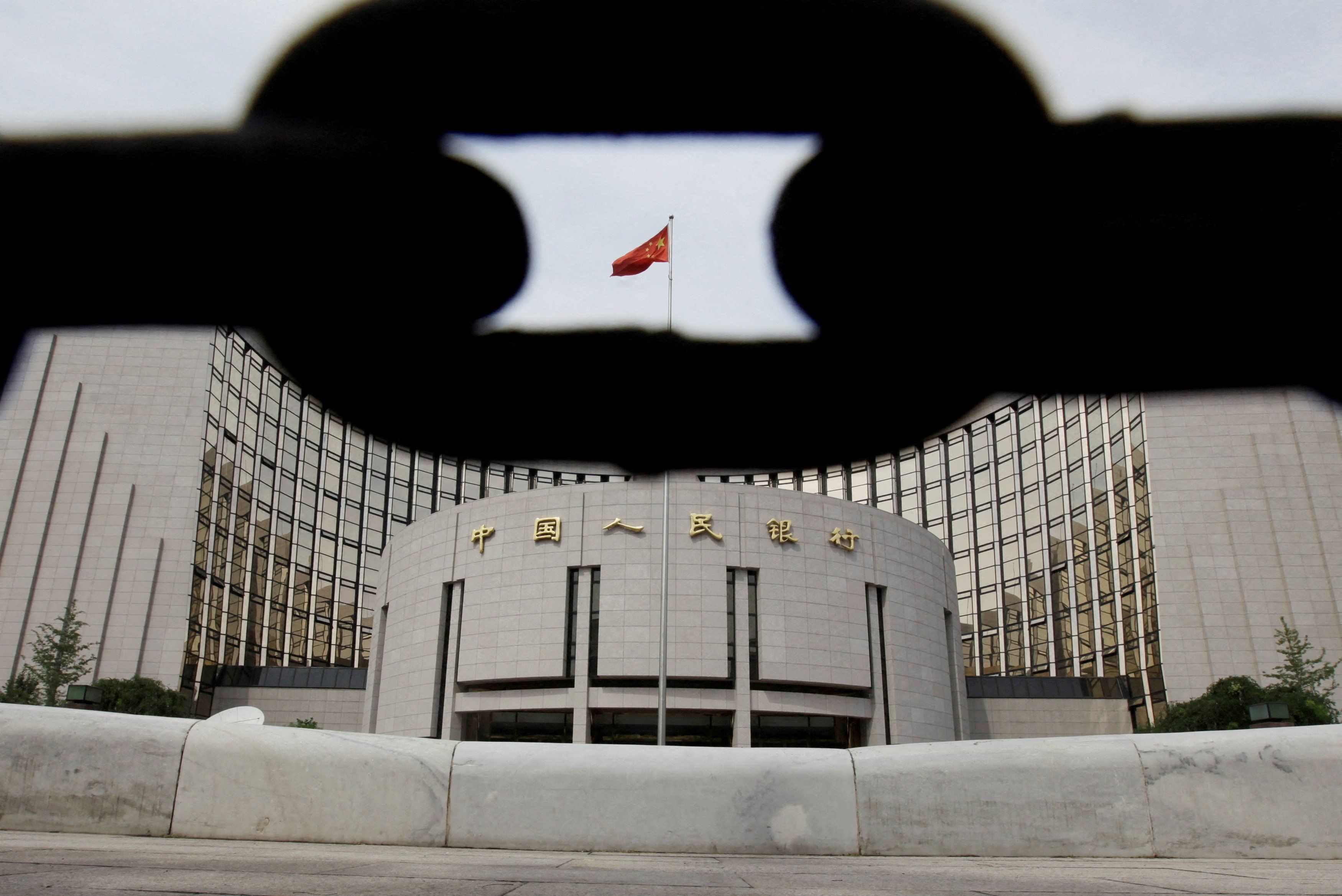 The headquarters of the People's Bank of China is pictured behind an iron chain in Beijing.