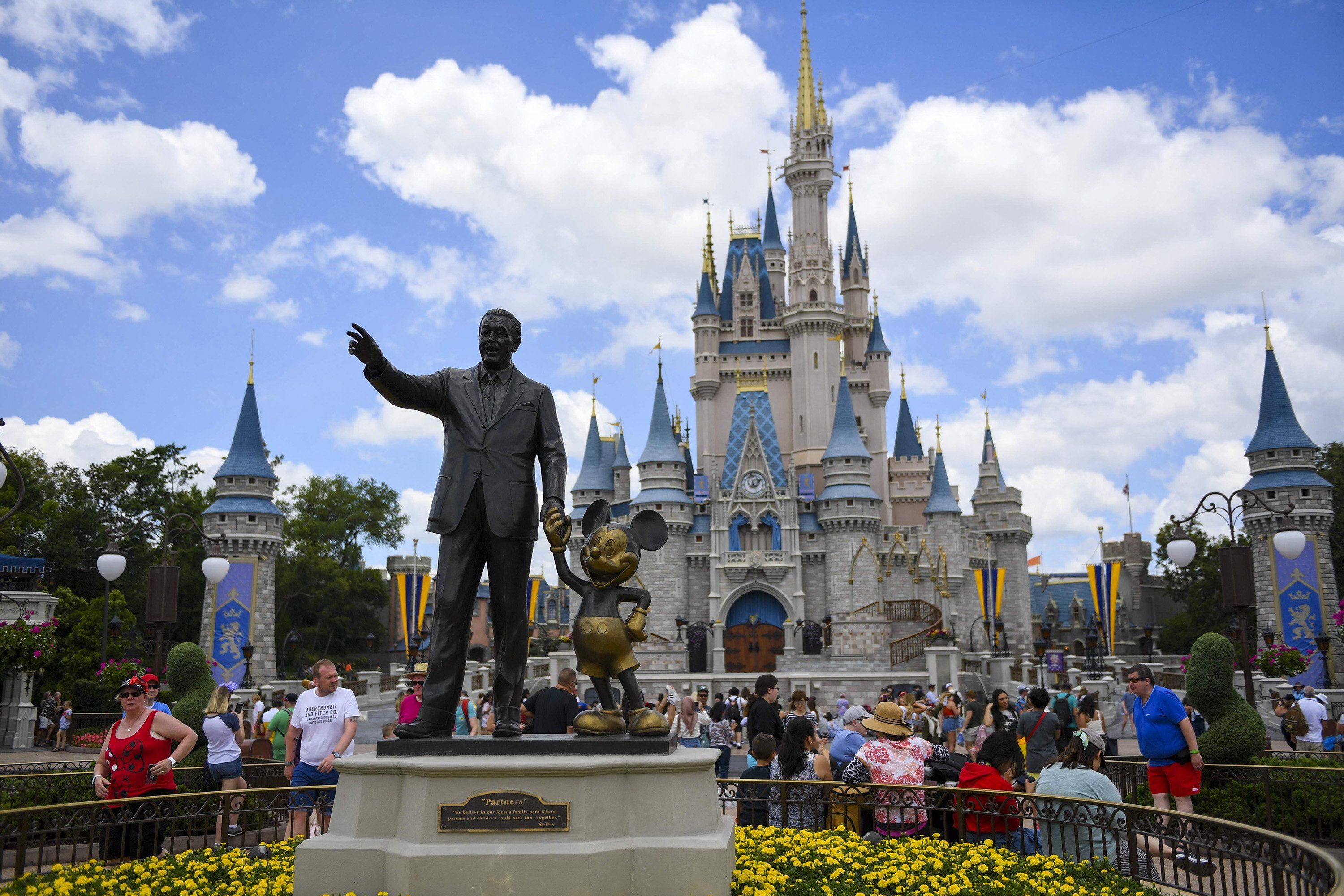 The Walt Disney and Mickey Mouse "Partners" statue outside Cinderella's Castle at Disney World's Magic Kingdom. ​